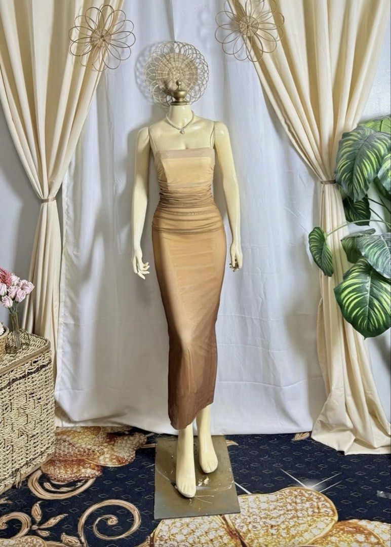 Beige Maxi Dress Gradient (Category: Dresses) located in Taguig. Submitted by kanimonadi (Listing ID 1470107916, Image 1). Description: - Stunning nude to brown gradient maxi dress - Strapless neckline with chic mesh overlay - Fully ruched, curve-hugging bodycon fit - Stretchy and comfortable fabric - Hits around the lower calf - Ideal for parties, evening outings, and special dinners.