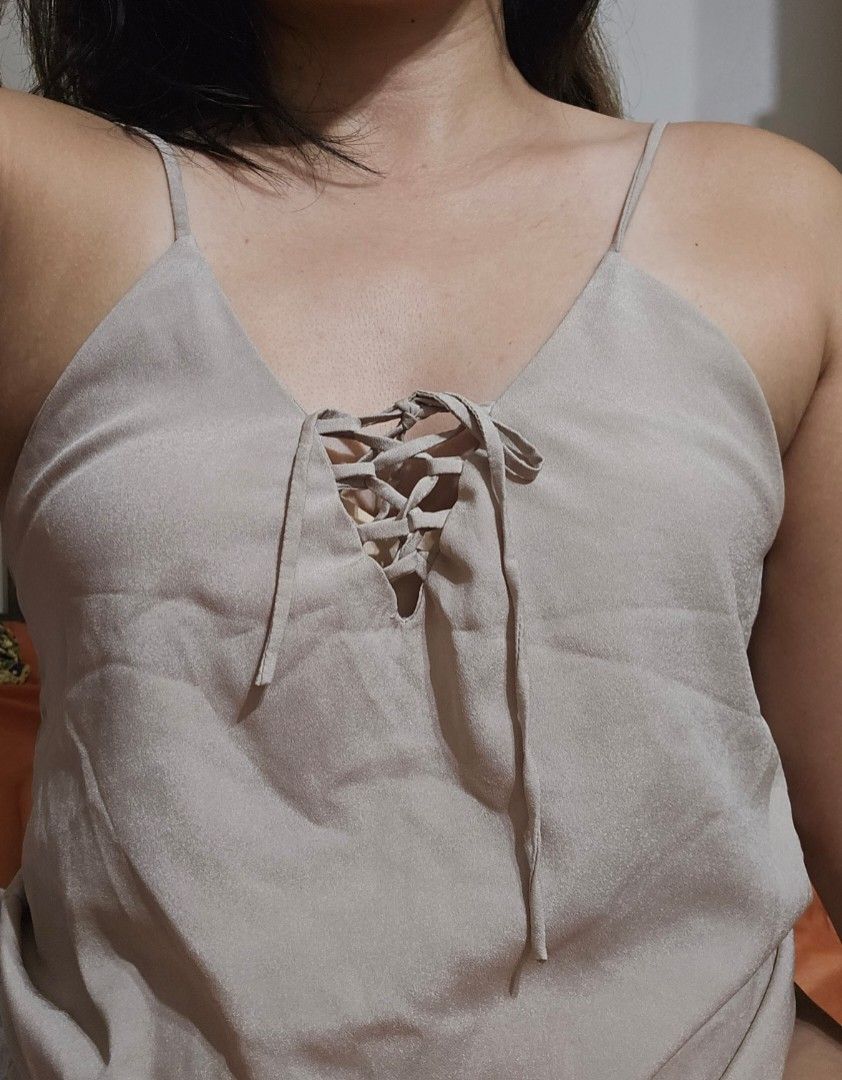 Beige satin sleeveless top (Category: Sleeveless) located in Mandaluyong City. Submitted by starcrazy (Listing ID 1469987541, Image 2). Description: Fits Medium to Large Beige satin with drawstring.