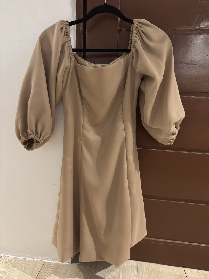 Beige Square Neck Puff Sleeve Dress (Category: Dresses) located in Santa Rosa. Submitted by maaarrriieela (Listing ID 1469976700, Image 1). Description: - Color: Neutral beige - Style: Midi dress with square neckline and dramatic puff sleeves - Details: Gathered elastic cuffs, fitted bodice with vertical panel seams, slight flare skirt - Fit: True to size - Perfect for: Gatherings, dinners, and special events.