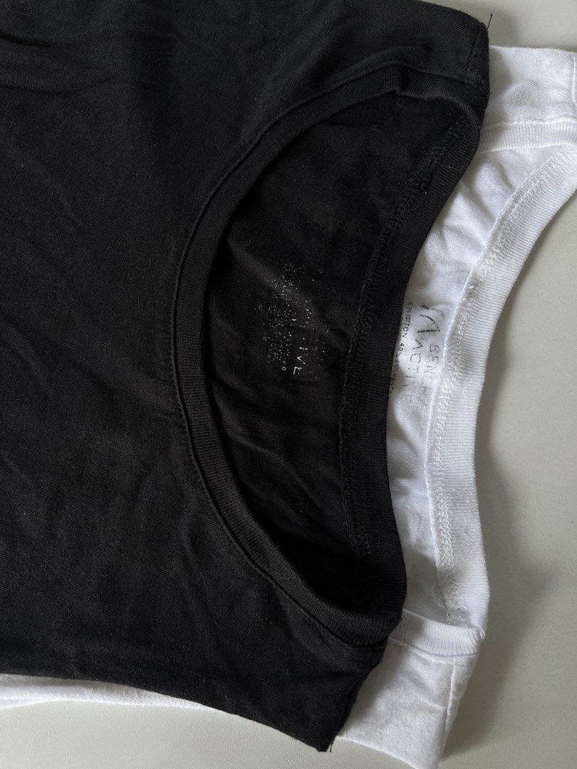 Bench Women’s Muscle Tee 2 Pcs (Category: Activewear) located in Santiago. Submitted by ricevllnz (Listing ID 1469958540, Image 2). Description: Basic but versatile muscle tees from BENCH, perfect for casual outfits, layering, or everyday wear. * Brand: Bench * Colors: Black and white * Style: Sleeveless muscle tee * Fit: Casual, relaxed style * Condition: Preloved Easy to pair with leggings, biker shorts, joggers, or jeans for a simple, sporty l