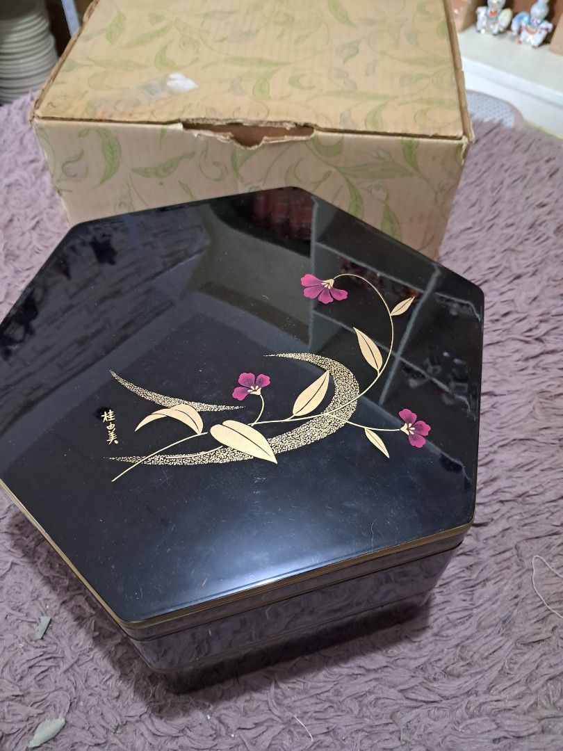 Bento box gift set (Category: Dinnerware & Cutlery) located in Cavite. Submitted by secretjapansurplus (Listing ID 1469986618, Image 1). Description: Brand New Old Stock] Yumi Katsura Hexagonal 2-Tier Japanese Lacquerware Box • Condition: Brand New Old Stock (NOS). Unused, pristine, and glossy. Comes with the original box (box shows minor storage wear due to age). • Design: Elegant glossy black exterior featuring a floral motif and Yumi Katsura's