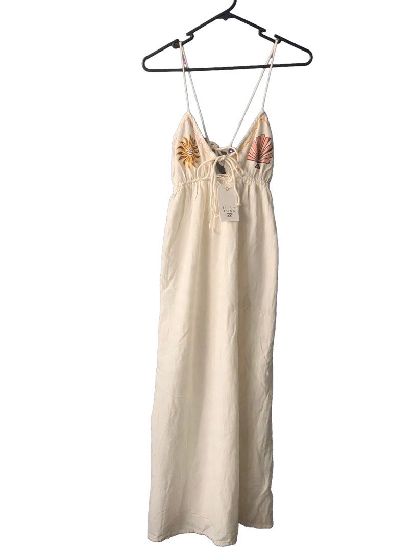 Billabong Wave Haze Midi Dress (Category: Dresses) located in Quezon City. Submitted by angge1013 (Listing ID 1470009075, Image 3). Description: - Brand: Billabong (Wave Haze Midi Dress) - Condition: Brand new with tags (BNWT), never worn - Size: Small - Color: Off-white - Details: Adjustable spaghetti straps, tie-front with keyhole cutout, embroidered sun & shell bodice graphics - Fit: Flowy and lightweight.