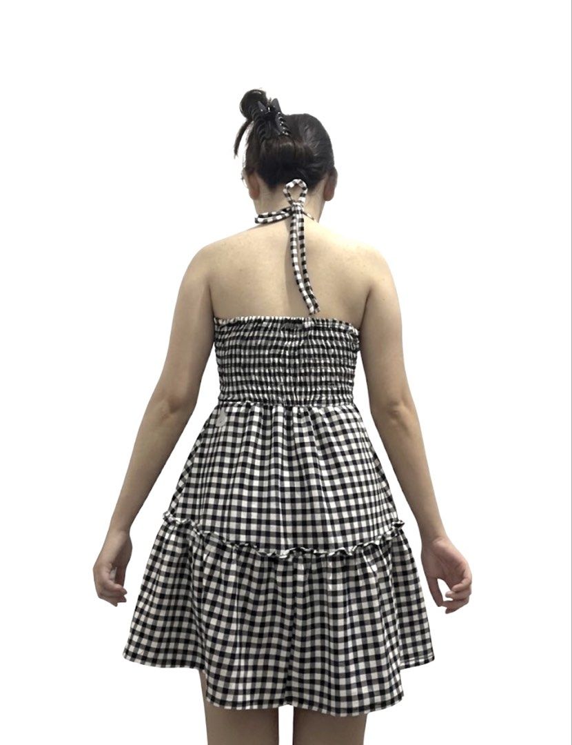 Black and white gingham halter mini dress (Category: Dresses) located in Santa Rosa. Submitted by vastmountain.c924cd (Listing ID 1470126907, Image 2). Description: Black & white checkered picnic mini dress featuring a halter neck and layered ruffled skirt. Actual dress is worn in the photo Fits size S to M with a stretchy smocked back..