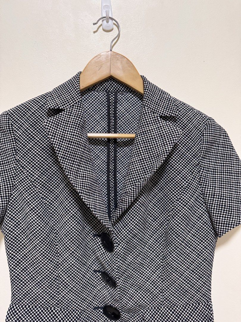 Black and White Patterned Short Sleeve Blazer (Category: Blouses) located in Manila. Submitted by seayouncey (Listing ID 1470055846, Image 3). Description: - Style: Black and white houndstooth jacket - Sleeves: Short sleeves with tailored fit - Details: Lapel collar, 3 black front buttons, 2 flap pockets, and back seam details - Versatility: Perfect for office wear or smart casual outfits - Condition: Excellent / Ready to wear.