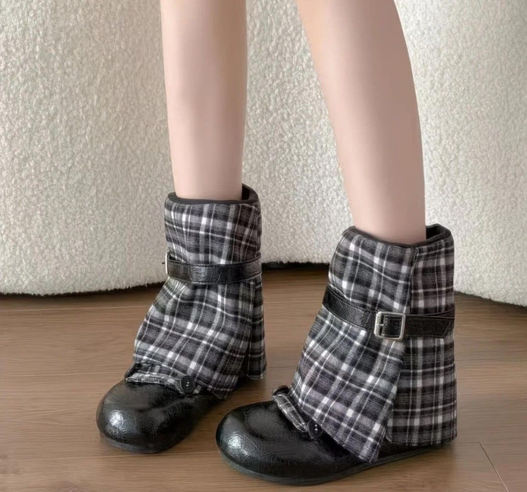 Black and white plaid ankle boots with buckle strap (Category: Boots) located in Makati City. Submitted by meghantherobot (Listing ID 1470112506, Image 1). Description: - Style: Alternative footwear with a bold black and white plaid pattern - Design: Fabric shaft featuring a trendy folded cuff - Accents: Glossy patent leather round toe caps and a side strap with a silver buckle - Comfort: Easy-to-wear flat soles for all-day use - Condition: Brand