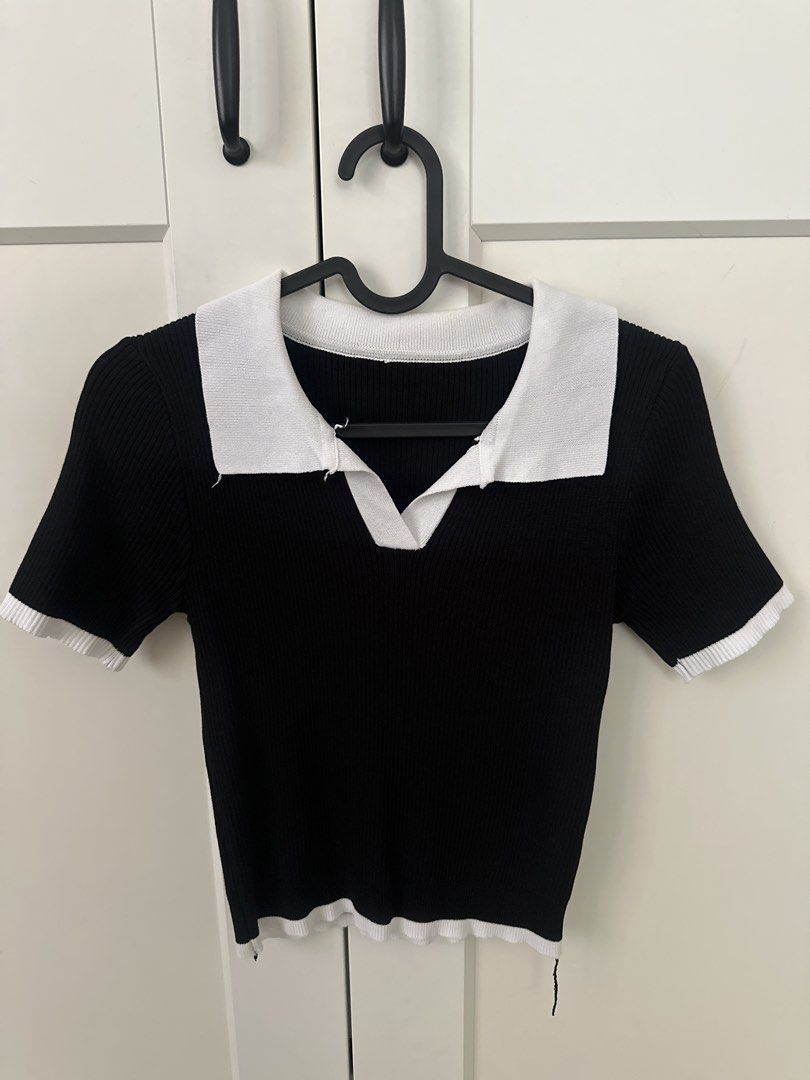 Black and white ribbed knit polo top (Category: Sleeveless) located in Manila. Submitted by kirstenxd (Listing ID 1470016771, Image 1). Description: - Color: Classic black with white contrast collar, cuffs, and hem - Material: Stretchy, comfortable ribbed knit fabric - Design: Open V-neck with a trendy monochrome aesthetic - Styling: Versatile piece that pairs effortlessly with high-waisted jeans or skirts - Occasion: Ideal for casual daily wear 