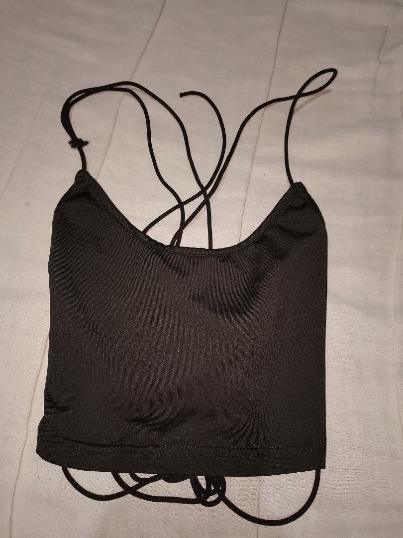 Black Cami Crop Top with Back Straps (Category: Sleeveless) located in Batangas. Submitted by sheenx.09 (Listing ID 1470073033, Image 1). Description: - Color: Classic Black - petite xxs on tag (xxs to xs) - Style: Scoop neckline with skinny straps and trendy tie cords 😄 - Fit: Stretchy, ribbed fabric with adjustable ties at the back and lower hem ♥️ - Versatility: Great for layering or wearing solo on warm days - Condition: Brand new / Excellen