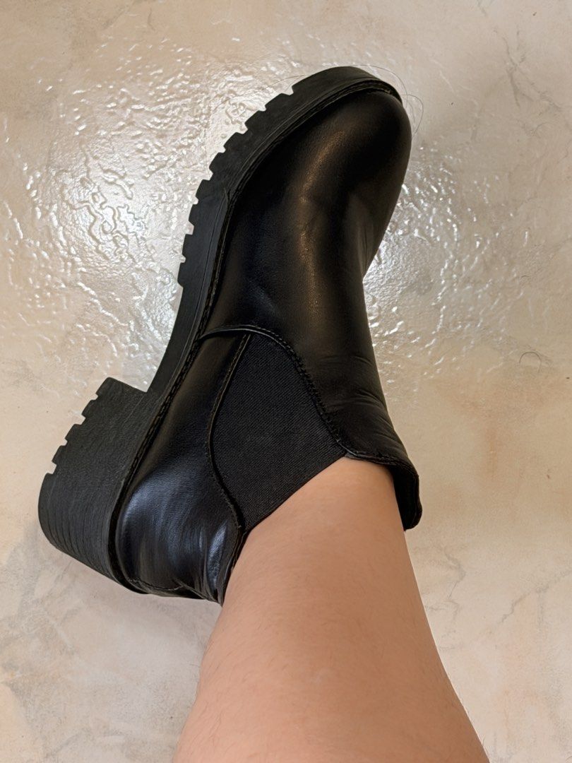 Black Chelsea Boots Platform Lug Sole Size 37 (Category: Boots) located in Cebu City. Submitted by liatan08 (Listing ID 1469994356, Image 2). Description: - Style: Black ankle boots with elastic side panels and slip-on design - Sole & Heel: Chunky lug sole and stylish block heel - Size: 37 (marked on bottom sole) - Material: Leather-like upper, clean inside - Condition: Worn a few times with minor dirt on the soles from walking outside.