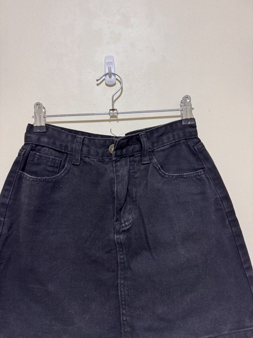 Black Denim Skirt (Category: Skirts) located in Manila. Submitted by seayouncey (Listing ID 1470054454, Image 3). Description: Size: waist line 27 inchs, length 14 inchs - Color: Classic Black - Style: Denim mini skirt with straight hem - Features: Button fly, belt loops, front pockets, and back patch pockets - Versatility: Easy to pair with tees, crop tops, and more - Condition: Brand new / Excellent quality.