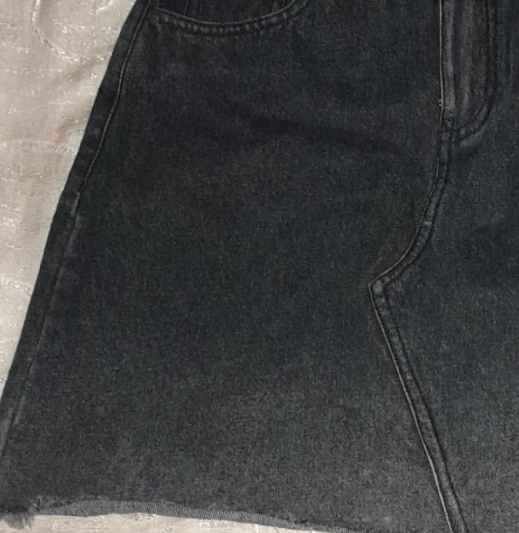 Black Denim Skirt Raw Hem (Category: Skirts) located in Manila. Submitted by chasndvl (Listing ID 1470140389, Image 1). Description: - Color: Dark greyish-black with a slight wash effect - Hem: Trendy raw frayed hem - Design: Classic five-pocket style with belt loops and button-zip fly - Details: Back yoke and two functional back patch pockets - Material: Sturdy denim fabric - Fit: Great casual everyday staple piece bought from ukay for 149 and d