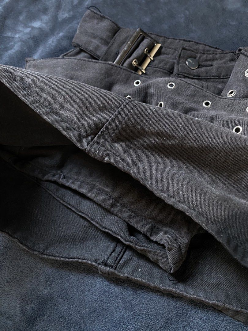 Black Denim Skort with Belt and Silver Eyelets (Category: Skirts) located in Manila. Submitted by sieee9 (Listing ID 1469988628, Image 2). Description: Black high-waisted denim skort 24-25 waist with built-in shorts for worry-free wear. Includes a matching wrap belt with metal eyelets and a chunky silver buckle. Features a front button closure and sturdy denim with slight fading. Perfect for casual outings! 💞.