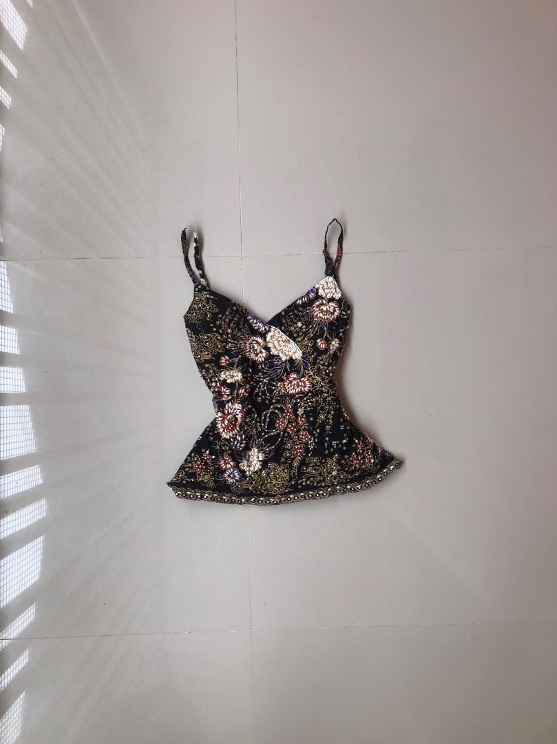 Black Floral Print Cami Top with Spaghetti Straps (Category: Sleeveless) located in Davao. Submitted by christ07_fox (Listing ID 1470037573, Image 1). Description: - Color & Pattern: Black with intricate floral details and subtle sparkle - Neckline & Straps: V-neck cut with thin spaghetti straps - Hemline: Embellished beaded trim along the bottom - Fit: Flowy and comfortable, ideal for warm weather or evening wear - Home: Kept in a clean, smoke-f