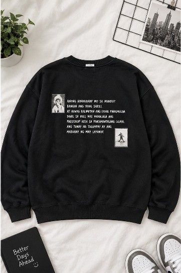 Black Graphic Sweatshirt with Tagalog Quote (Category: Coats, Jackets and Outerwear) located in Manila. Submitted by joelgarcia.0000 (Listing ID 1469971701, Image 1). Description: - Color: Black - Design: Graphic prints with Tagalog text on the chest - Material: Thick fleece fabric inside for warmth - Features: Long sleeves, ribbed cuffs, and hem - Condition: Great piece for casual wear, clean and well-maintained.