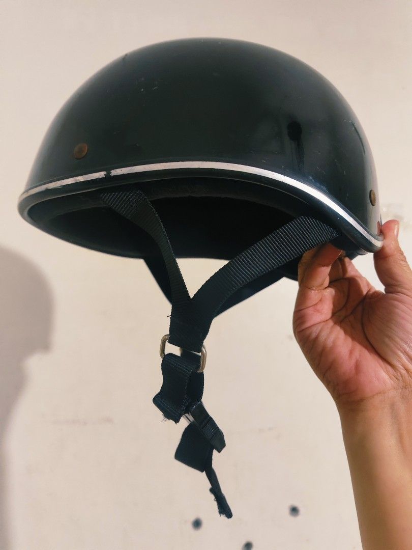 Black Half Helmet with Silver Trim and Chin Strap (Category: Caps & Hats) located in Bulacan. Submitted by babz30261 (Listing ID 1470088694, Image 3). Description: - Color: Glossy black with metallic silver trim - Hardware: Brass-tone snap buttons and front strap attachment - Chin Strap: Adjustable black strap with quick-release buckle - Interior: Comfortable dark padding - Safety: Certified safety sticker included - Condition: Normal signs of us