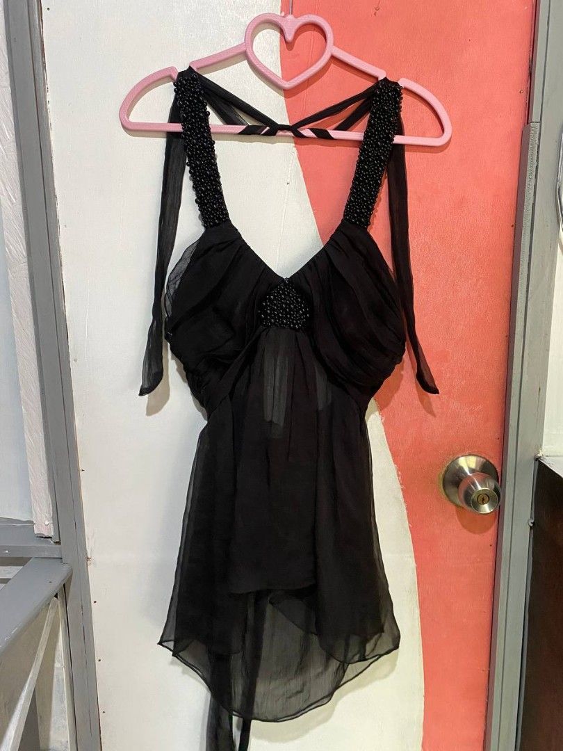 Black Halter Neck Beaded Chiffon Top (Category: Sleeveless) located in Iloilo. Submitted by xya.xoxo28 (Listing ID 1470125155, Image 1). Description: - Style: Y2K clubwear / night out - Material: Lightweight, sheer flowy chiffon - Details: Heavy beadwork on thick straps and center bust - Neckline: V-neck with gathered pleats - Closure: Adjustable tie straps at the neck and back - Hem: Trendy asymmetric cut.