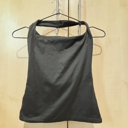 Black Halter Top Cowl Neck Backless Sleeveless (Category: Sleeveless) located in Quezon City. Submitted by slvrbullet (Listing ID 1470139967, Image 2). Description: - Color: Solid black - Design: Cowl neck front, straight cut back, sleeveless with a thick neck strap - Fit: Stretchy fabric, highly versatile and easy to pair with jeans or skirts - Condition: Clean, no stains or holes, ready to wear.