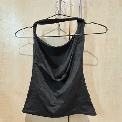 Black Halter Top Cowl Neck Backless Sleeveless (Category: Sleeveless) located in Quezon City. Submitted by slvrbullet (Listing ID 1470139967, Image 1). Description: - Color: Solid black - Design: Cowl neck front, straight cut back, sleeveless with a thick neck strap - Fit: Stretchy fabric, highly versatile and easy to pair with jeans or skirts - Condition: Clean, no stains or holes, ready to wear.