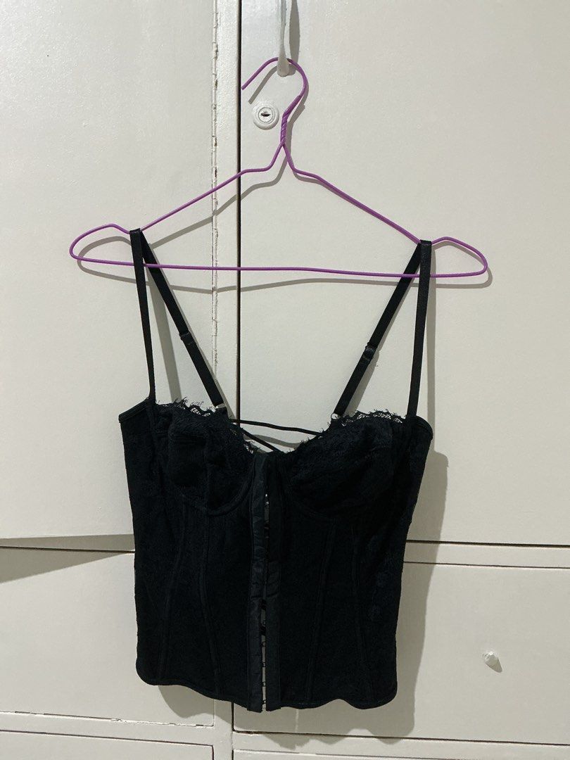 Black lace corset top with adjustable straps (Category: Sleeveless) located in Rizal. Submitted by kyliemaine (Listing ID 1470038087, Image 1). Description: - Style: Goth / Vintage lingerie vibe - Design: Black lace corset top with molded cups - Closure: Front hook-and-eye with lace-up crisscross back for adjustable fit - Straps: Adjustable double shoulder straps - Structure: Fully boned for support - Styling: Wear solo or layer over a basic tee.