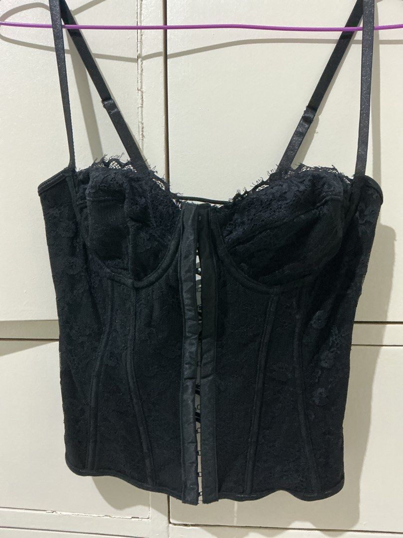 Black lace corset top with adjustable straps (Category: Sleeveless) located in Rizal. Submitted by kyliemaine (Listing ID 1470038087, Image 2). Description: - Style: Goth / Vintage lingerie vibe - Design: Black lace corset top with molded cups - Closure: Front hook-and-eye with lace-up crisscross back for adjustable fit - Straps: Adjustable double shoulder straps - Structure: Fully boned for support - Styling: Wear solo or layer over a basic tee.