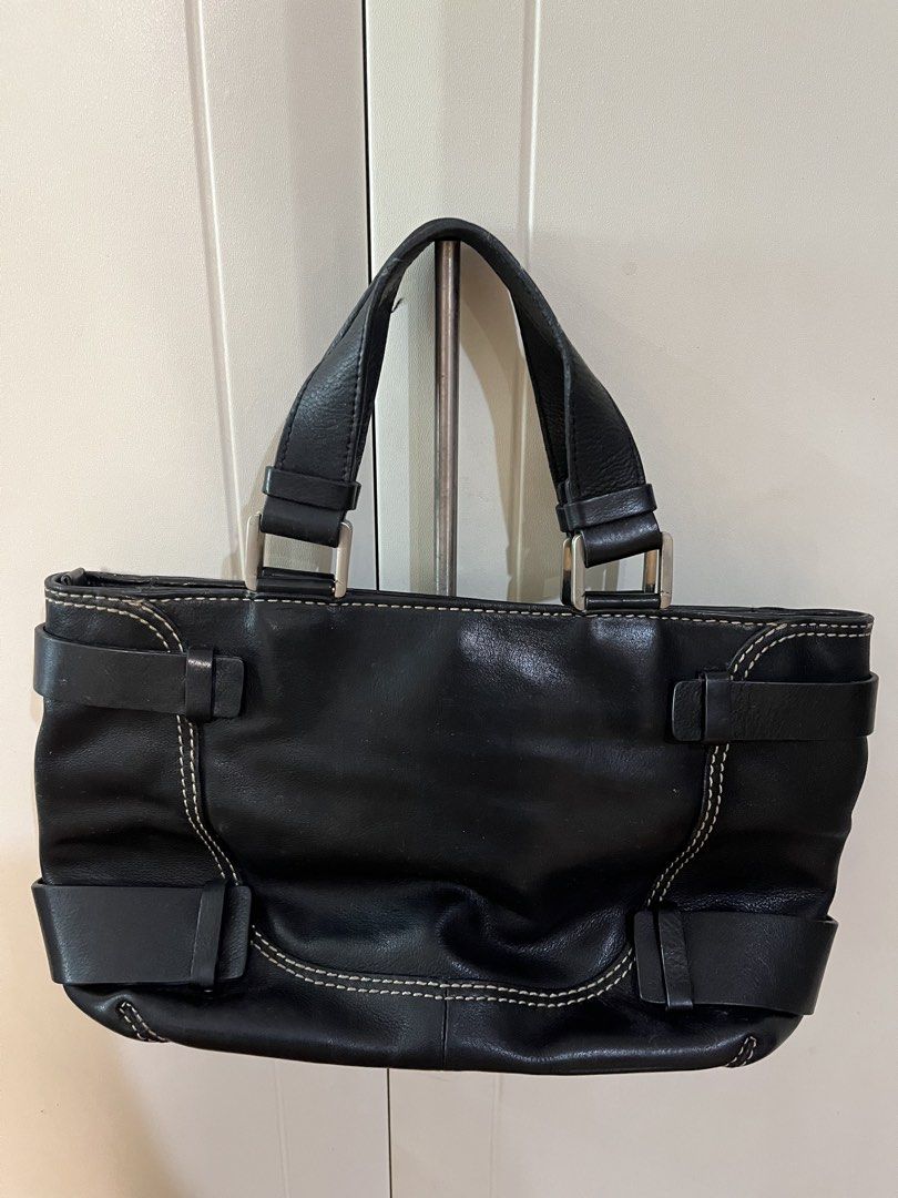 Black Leather Bag with Buckle Details (Category: Tote Bags) located in Makati City. Submitted by sodypop88 (Listing ID 1470050379, Image 3). Description: - Color & Material: Classic black leather with stylish contrast stitching - Hardware: Sleek silver-tone accents and trendy buckle straps on the front and sides - Design: Double top handles with a secure main zip closure - Interior: Spacious everyday carryall featuring multiple storage sections f