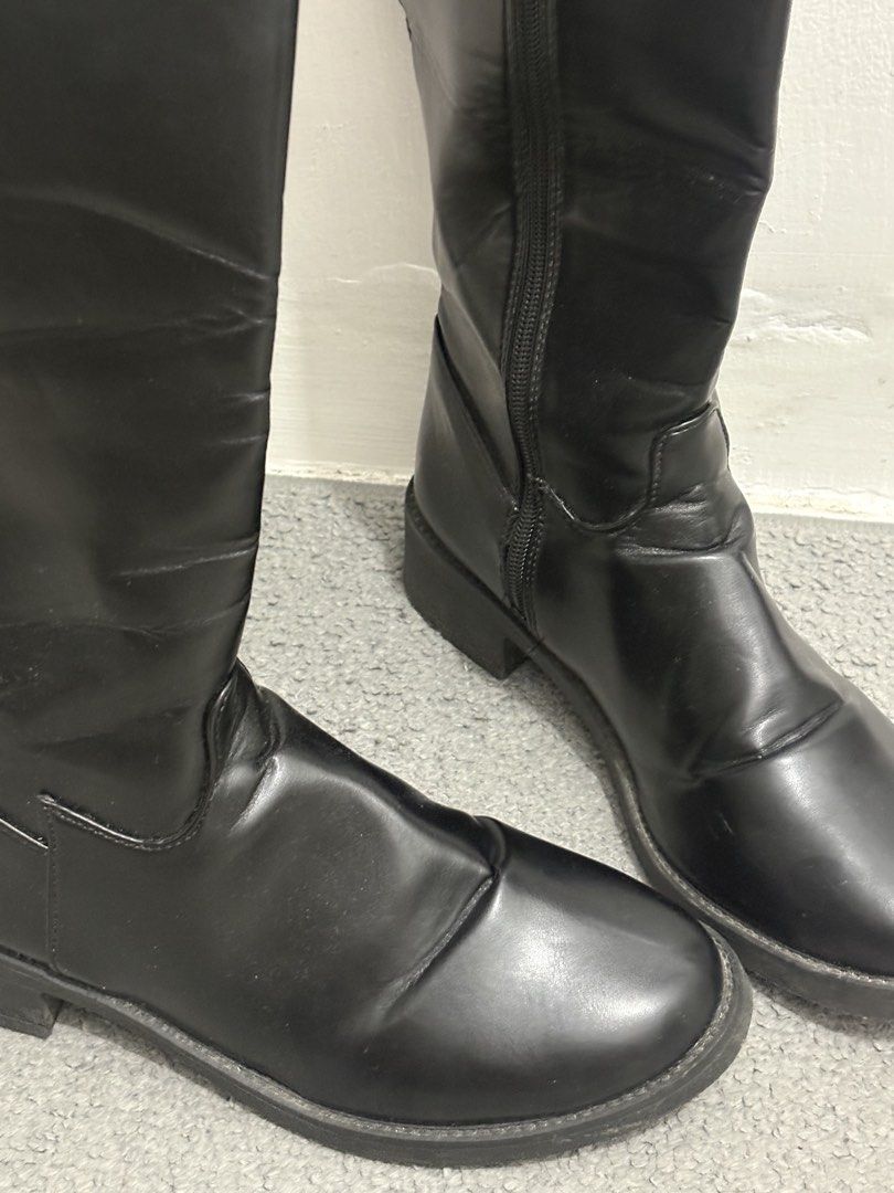 Black Long Boots Knee High With Zips - SHEIN (Category: Boots) located in Pasig City. Submitted by _jinwifeu_ (Listing ID 1470051044, Image 3). Description: - Comfort: Low heel, round toe perfect for 20,000 steps ++ - Condition: Worn a few times with minimal crease marks near the ankles - Easy to pull on and style with any outfit.