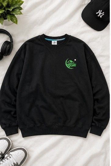 Black Long-Sleeve Sweatshirt with Green Graphic (Category: Coats, Jackets and Outerwear) located in Manila. Submitted by joelgarcia.0000 (Listing ID 1469971592, Image 1). Description: - Color: Black - Style: Long sleeve pullover with classic crew neck and V-stitch detail - Design: Small green house and landscape graphic on left chest - Details: Ribbed cuffs and hem - Fit: Comfortable everyday wear.