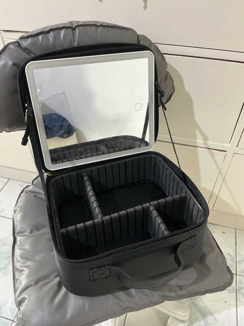 Black Makeup Train Case with LED Light Mirror (Category: Makeup) located in Rizal. Submitted by kyliemaine (Listing ID 1470033633, Image 1). Description: - Color & Material: Stylish black leatherette finish - Built-in Lighting: Lid features a convenient built-in lighted mirror - Customizable Storage: Adjustable sponge dividers to fit your cosmetics and brushes - Extra Protection: Interior pouch flap keeps palettes secure and protects brushes - Po
