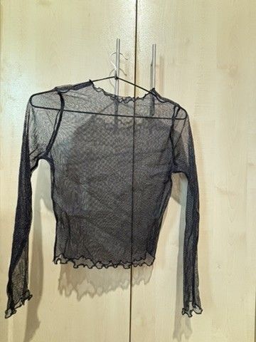 Black mesh long sleeve top lettuce trim (Category: Longsleeves) located in Quezon City. Submitted by slvrbullet (Listing ID 1470139958, Image 1). Description: - Color: Black - Style: Sheer mesh top with long sleeves - Details: Lettuce edges on collar, cuffs, and hem - Material: Stretchy, lightweight, and breathable - Fit/Use: Great for layering over bralettes or tanks - Condition: Worn a couple of times, still in solid shape Flaws: Removed Tag. S