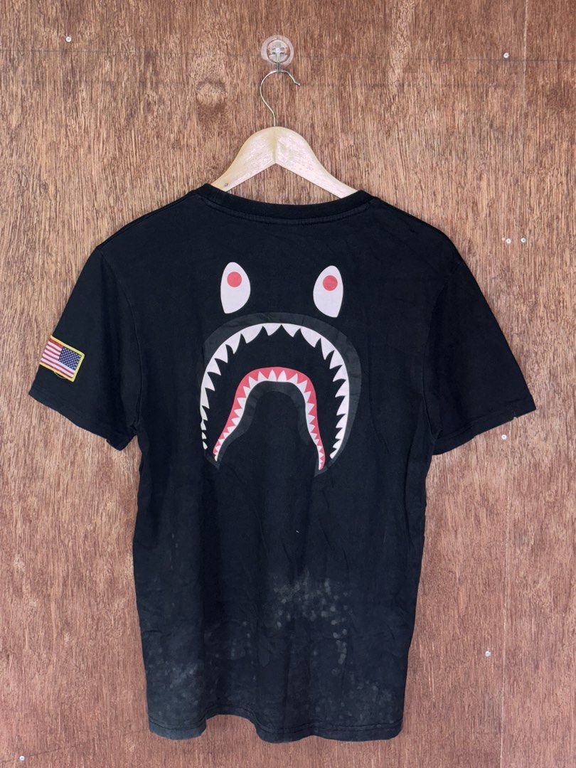 Black Nike x A Bathing Ape T-shirt (Category: Tshirts & Polo Shirts ) located in Cabuyao City. Submitted by giothr1ft (Listing ID 1470064188, Image 2). Description: -Width: 20 -Length: 27 -Condition: 5/10 📌Buyers will shoulder the shipping fee.