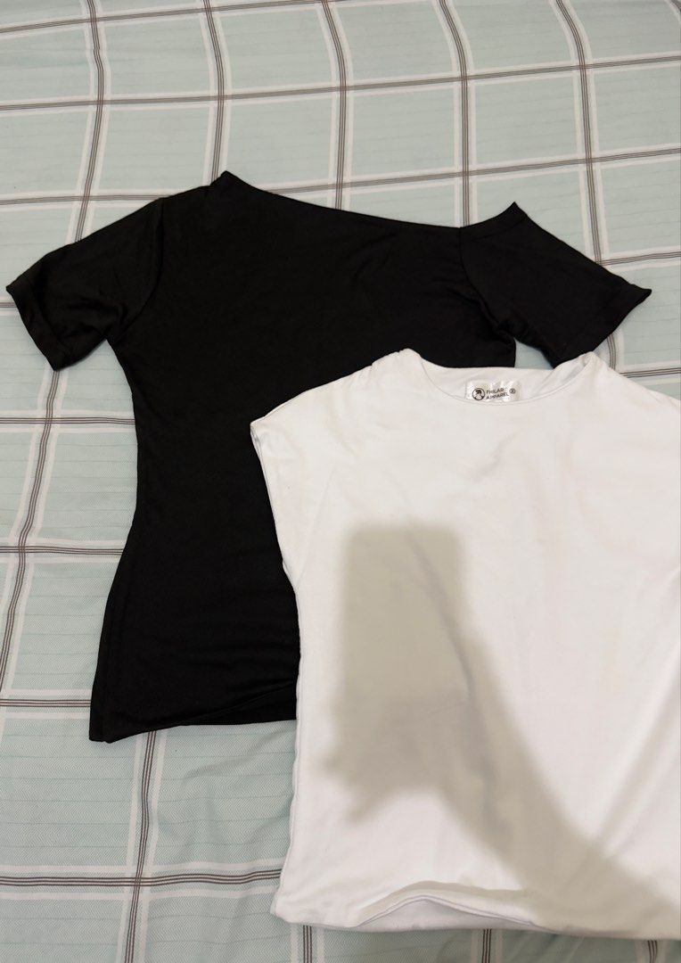 Black off-shoulder top and white cap-sleeve shirt bundle (Category: Blouses) located in Manila. Submitted by misskendrapreloved (Listing ID 1470101047, Image 1). Description: - Bundle includes: 2 basic everyday tops - Item 1: Black off-shoulder top with short sleeves - Item 2: White round-neck top with cap sleeves (from Fhilar Apparel) - Material: Stretchy, soft, and very comfortable - Styling: Easy to match with any jeans, shorts, or skirts - Co