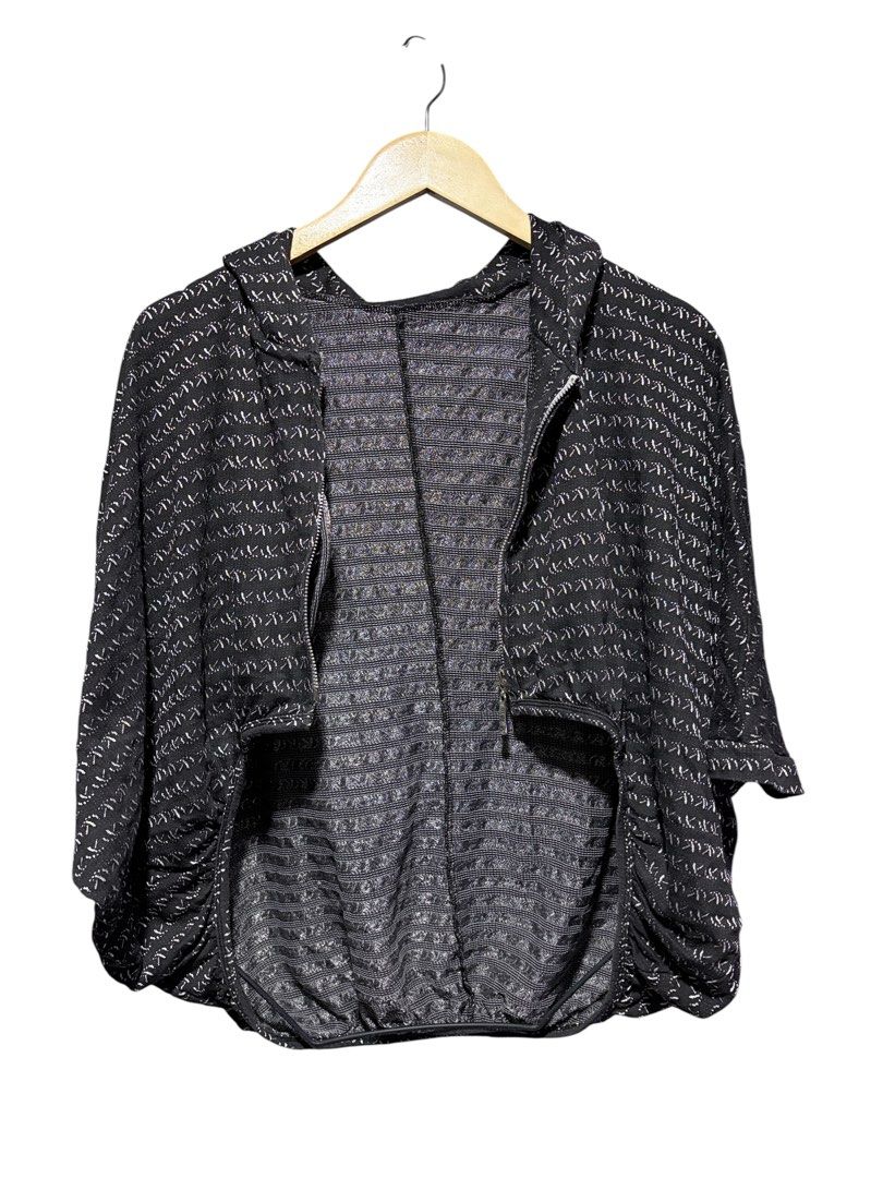 Black patterned zip-up hooded poncho cape (Category: Coats, Jackets and Outerwear) located in Cavite. Submitted by grandearth.39df3f (Listing ID 1470019276, Image 3). Description: - Stylish black and white patterned design - Comfortable batwing style with half-length sleeves - Secure full front zipper closure and cozy hood - Cinched elastic hem for a flattering fit - Textured woven inner lining for extra comfort - Lightweight layering piece perfe