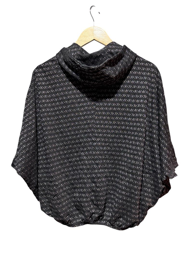 Black patterned zip-up hooded poncho cape (Category: Coats, Jackets and Outerwear) located in Cavite. Submitted by grandearth.39df3f (Listing ID 1470019276, Image 2). Description: - Stylish black and white patterned design - Comfortable batwing style with half-length sleeves - Secure full front zipper closure and cozy hood - Cinched elastic hem for a flattering fit - Textured woven inner lining for extra comfort - Lightweight layering piece perfe
