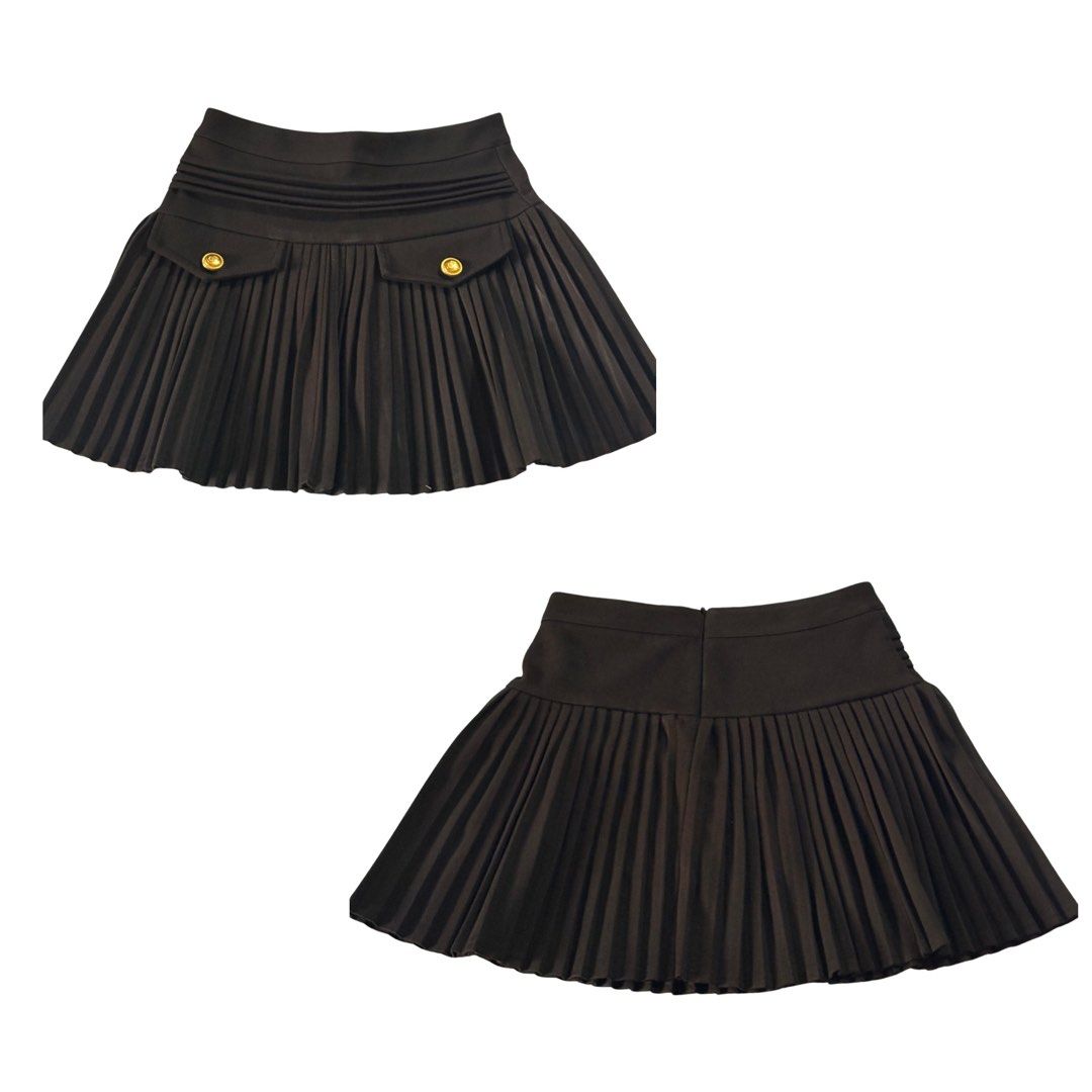 Black pleated mini skirt with gold buttons (Category: Skirts) located in Manila. Submitted by lorainelouise (Listing ID 1470036642, Image 1). Description: Size- waist-26 - Color: Black - Style: Pleated mini skirt / short flare - Waistband: Wide waistband with side zipper closure - Details: Two decorative front pockets with gold-tone buttons - Material: Smooth, comfortable fabric - Condition: Excellent - with safety shorts .