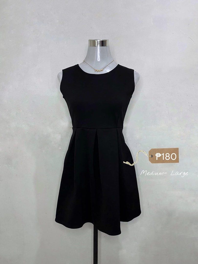 Black Pleated Sleeveless Mini Dress (Category: Dresses) located in Manila. Submitted by jhane.micha (Listing ID 1470070396, Image 1). Description: - Style: Classic minimal black sleeveless dress - Fit: Fitted bodice with a flared pleated skirt, fits medium to large frames - Neckline: Round neckline - Versatility: Easy to dress up or down for any day out.