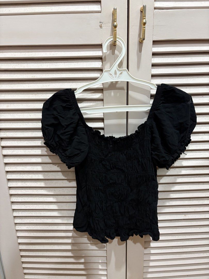 Black Puff Sleeve Tie Front Top (Category: Blouses) located in Muntinlupa City. Submitted by sukimum (Listing ID 1469973783, Image 2). Description: No brand black puffed sleeve top with a front tie and smocked back. Fabric is soft and lightweight, very easy to pair and dress up! Fits XS-S. (brand as helping tag only).