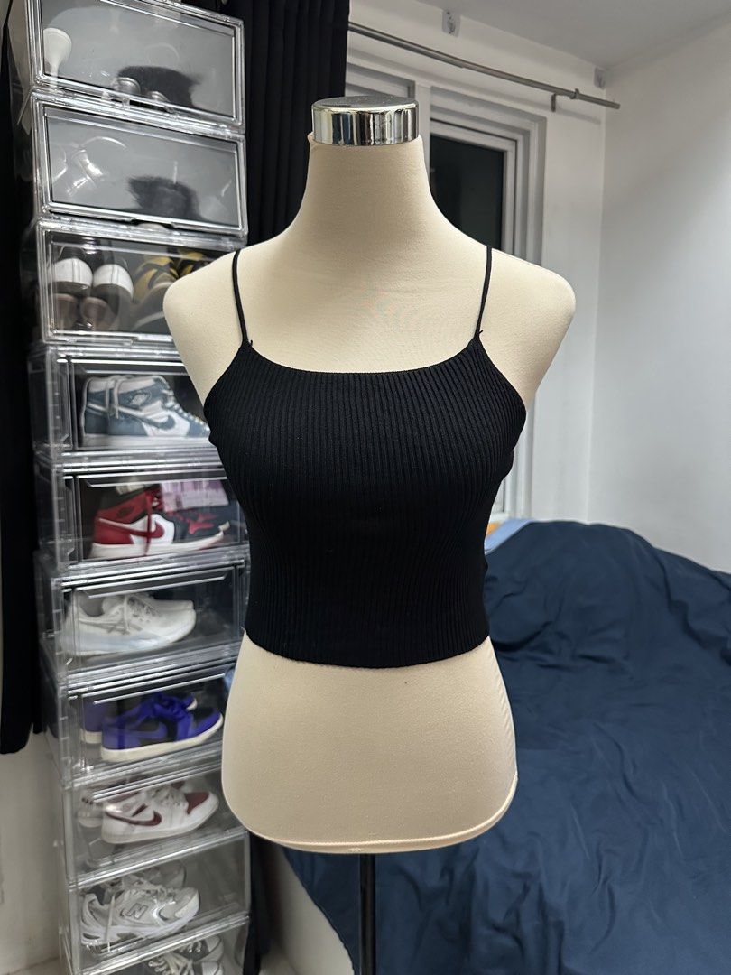 Black ribbed spaghetti strap crop top (Category: Sleeveless) located in Quezon City. Submitted by valeriorac74670 (Listing ID 1470045566, Image 1). Description: - Color: Classic Black - Style: Fitted ribbed crop top with straight neckline and thin spaghetti straps - Material: Stretchy, comfortable knit fabric - Length: Cropped around the waist - Versatility: Perfect basic piece for layering or standalone wear.