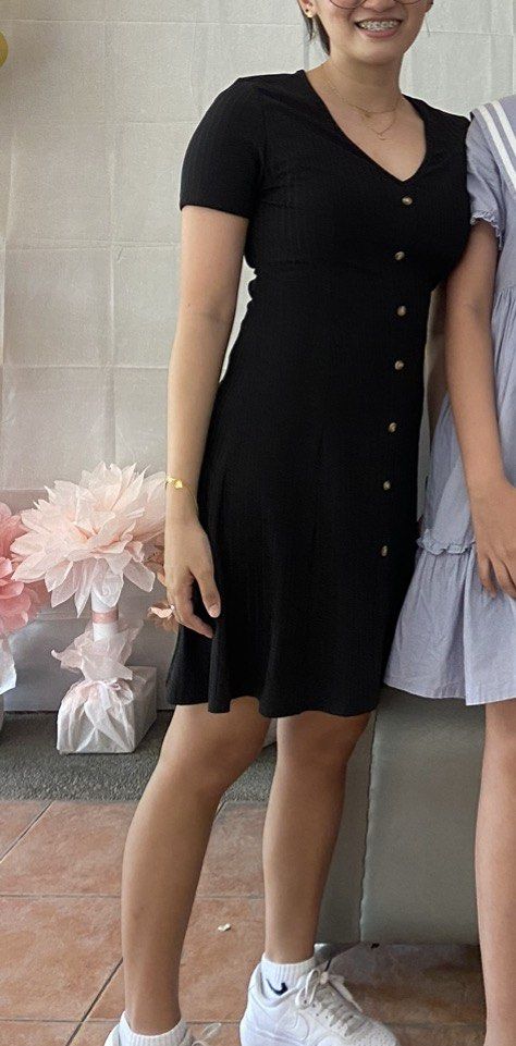 Black Ribbed V-Neck Short Sleeve Button-Front Mini Dress (Category: Dresses) located in Santa Rosa. Submitted by maaarrriieela (Listing ID 1469968674, Image 2). Description: - Brand: SHEIN - Size: S (EU 36 / UK 8 / US 4) - Color: Classic black - Material: Stretchy ribbed knit fabric for ultimate comfort - Design: V-neckline, short sleeves, and functional light brown front buttons - Fit: Fitted bodice with a flattering slight flare at the skirt - 