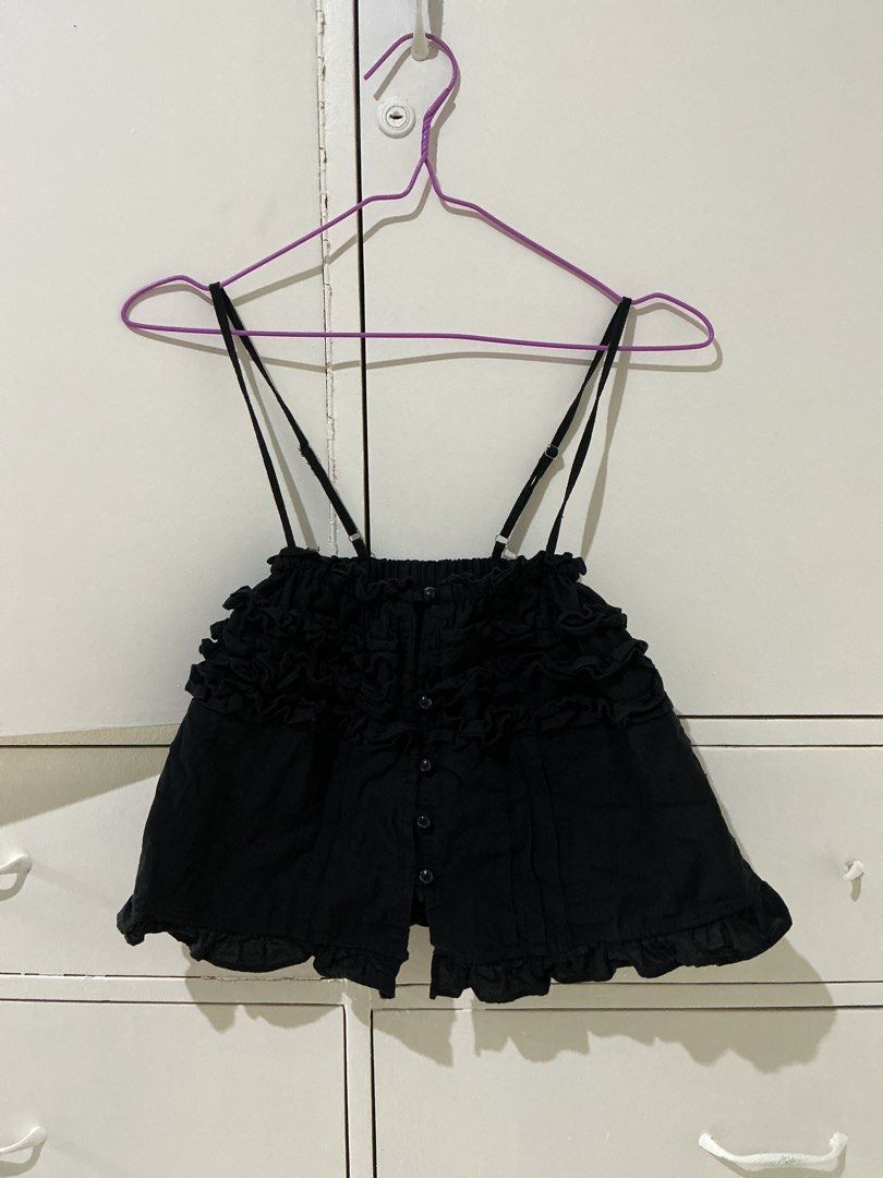 Black Ruffled Cami Top with Button Front (Category: Sleeveless) located in Rizal. Submitted by kyliemaine (Listing ID 1470028821, Image 1). Description: - Color: Black - Design: Ruffles across chest and hem with button-down front - Straps: Adjustable double spaghetti straps - Fit: Cropped, pairs well with high-waisted bottoms - Material: Lightweight and soft - Condition: Great shape, worn only a couple of times.