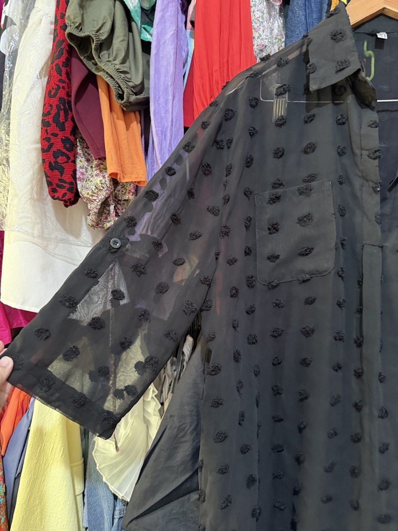 Black Sheer Half Button Blouse with Polka Dot (Category: Blouses) located in Antipolo. Submitted by harlowwillow (Listing ID 1469952504, Image 2). Description: No to low ballers Large on tag up to XL W L Can be worn as long top or dress but NEEDS INNER 😍 Polyester - Material: Lightweight, slightly sheer fabric with textured polka dot details - Design: Classic collar, front button-up placket, and single chest pocket - Sleeves: Long sleeves with a