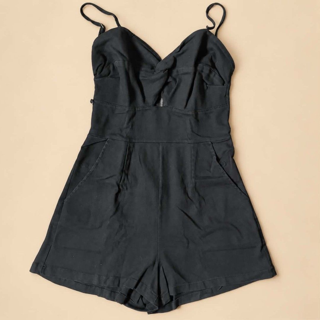 Black sleeveless romper with front pockets and adjustable straps (Category: Rompers) located in Manila. Submitted by joshbelgic17602 (Listing ID 1469969439, Image 1). Description: - Color: Classic black - Material: Lightweight and breathable, perfect for warm weather - Features: Adjustable spaghetti straps, stylish twisted bust detail - Pockets: Convenient deep side pockets - Fit: Fitted waist with a structured short cut - Styling: Easy to dress 
