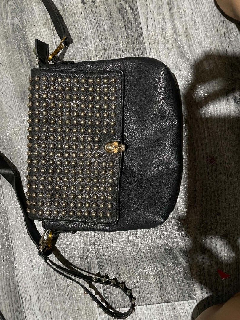Black Studded Shoulder Bag with Rhinestone Skull Clasp (Category: Shoulder Bags) located in Cagayan de Oro. Submitted by rhyrhyrhys (Listing ID 1470082002, Image 1). Description: - Black pebble-grain faux leather - Gold-tone rhinestone skull clasp and all-over metallic studs - no issue.