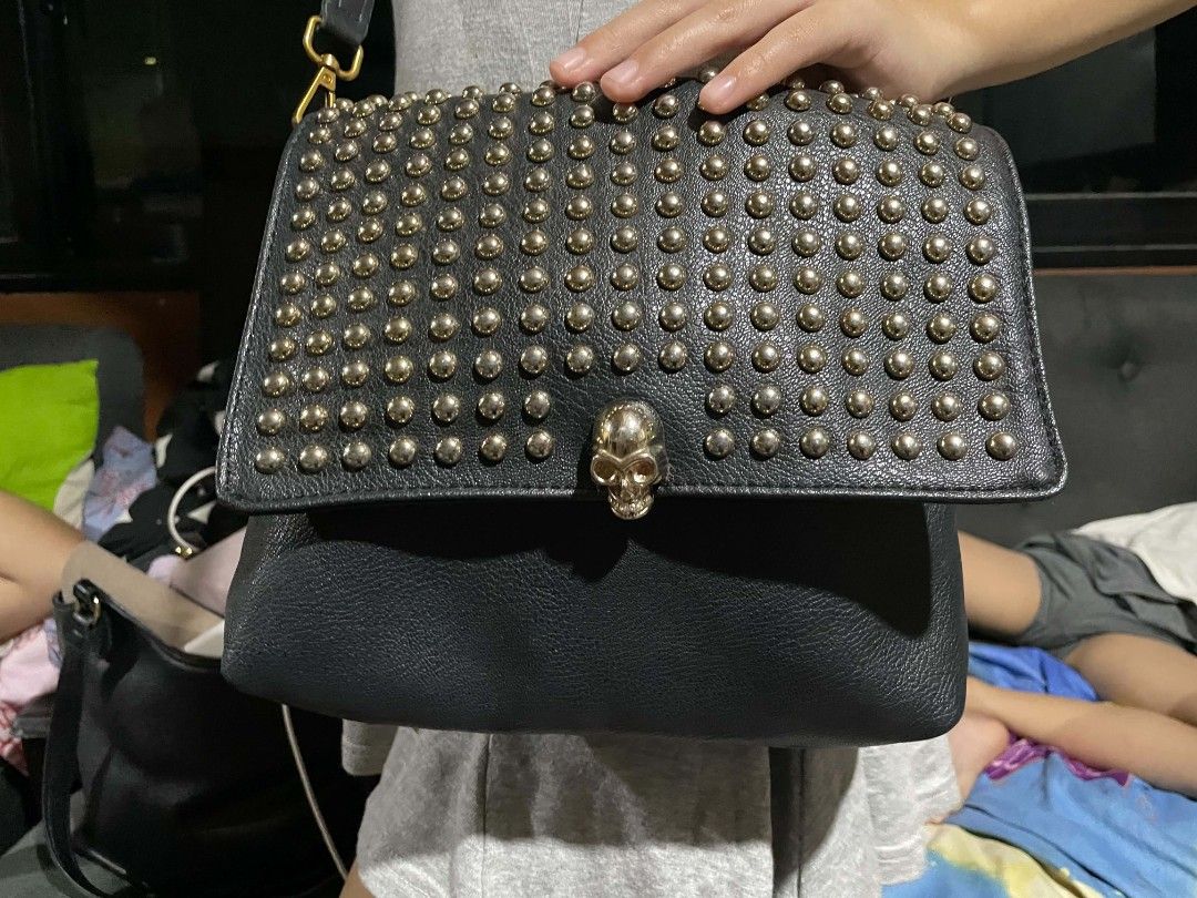 Black Studded Shoulder Bag with Rhinestone Skull Clasp (Category: Shoulder Bags) located in Cagayan de Oro. Submitted by rhyrhyrhys (Listing ID 1470082002, Image 3). Description: - Black pebble-grain faux leather - Gold-tone rhinestone skull clasp and all-over metallic studs - no issue.