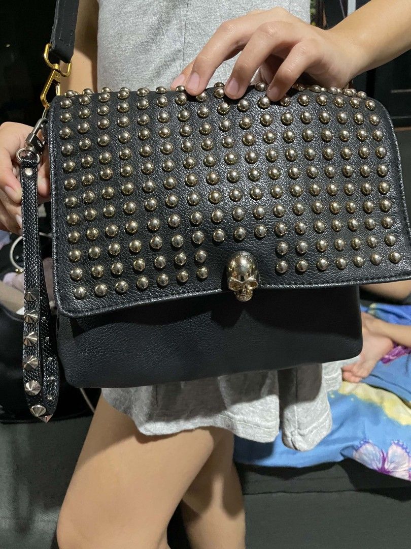 Black Studded Shoulder Bag with Rhinestone Skull Clasp (Category: Shoulder Bags) located in Cagayan de Oro. Submitted by rhyrhyrhys (Listing ID 1470082002, Image 2). Description: - Black pebble-grain faux leather - Gold-tone rhinestone skull clasp and all-over metallic studs - no issue.