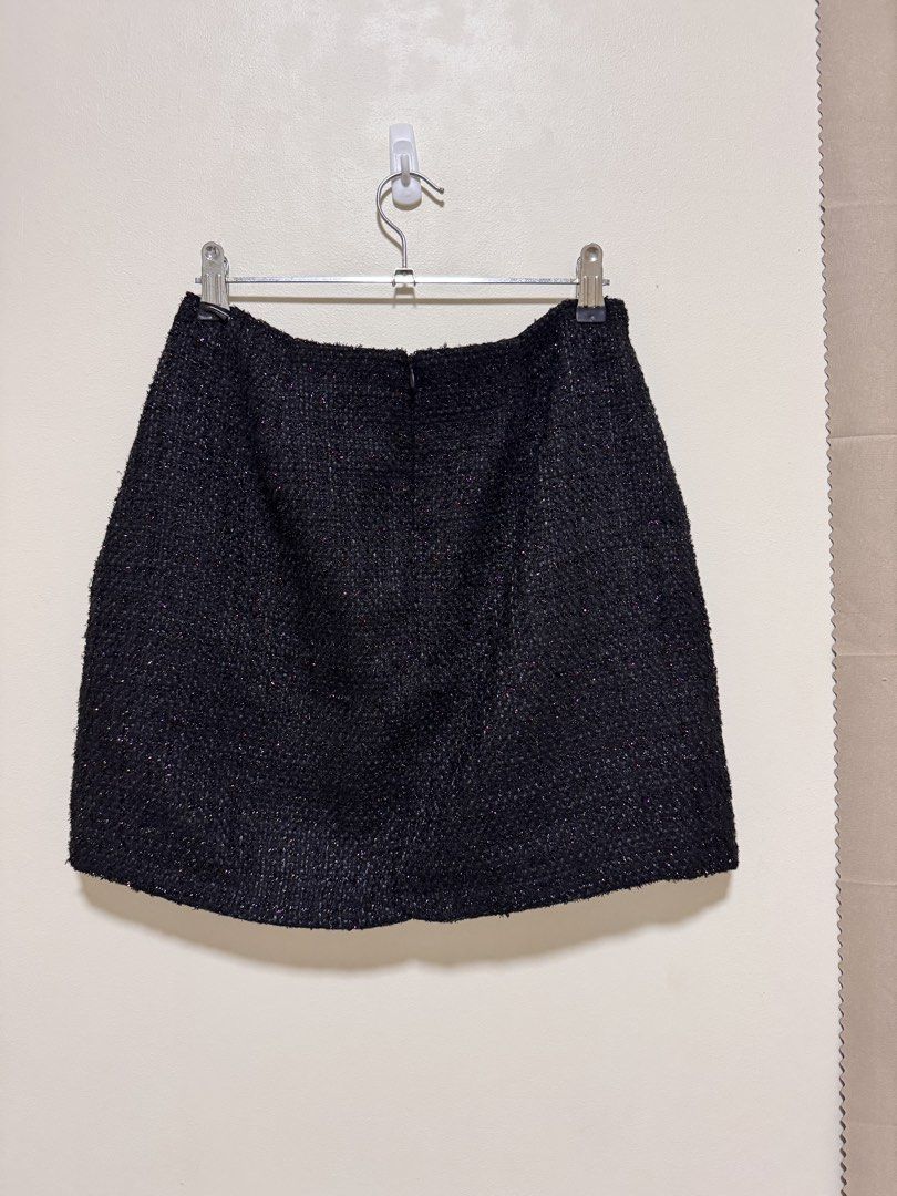 Black Tweed Skirt (Category: Skirts) located in Manila. Submitted by seayouncey (Listing ID 1470053696, Image 2). Description: Size: waist line 29 inchs, length 15 inchs - Brand: Primark - Size: UK 10 / EUR 38 / USA 6 - Color/Fabric: Black textured tweed with subtle sparkle - Features: Structured shape, smooth inner lining, hidden back zipper closure - Condition: Excellent, clean fabric with no pulls or visible wear.