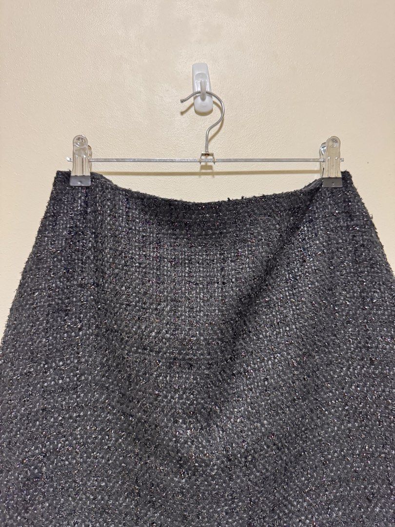 Black Tweed Skirt (Category: Skirts) located in Manila. Submitted by seayouncey (Listing ID 1470053696, Image 3). Description: Size: waist line 29 inchs, length 15 inchs - Brand: Primark - Size: UK 10 / EUR 38 / USA 6 - Color/Fabric: Black textured tweed with subtle sparkle - Features: Structured shape, smooth inner lining, hidden back zipper closure - Condition: Excellent, clean fabric with no pulls or visible wear.