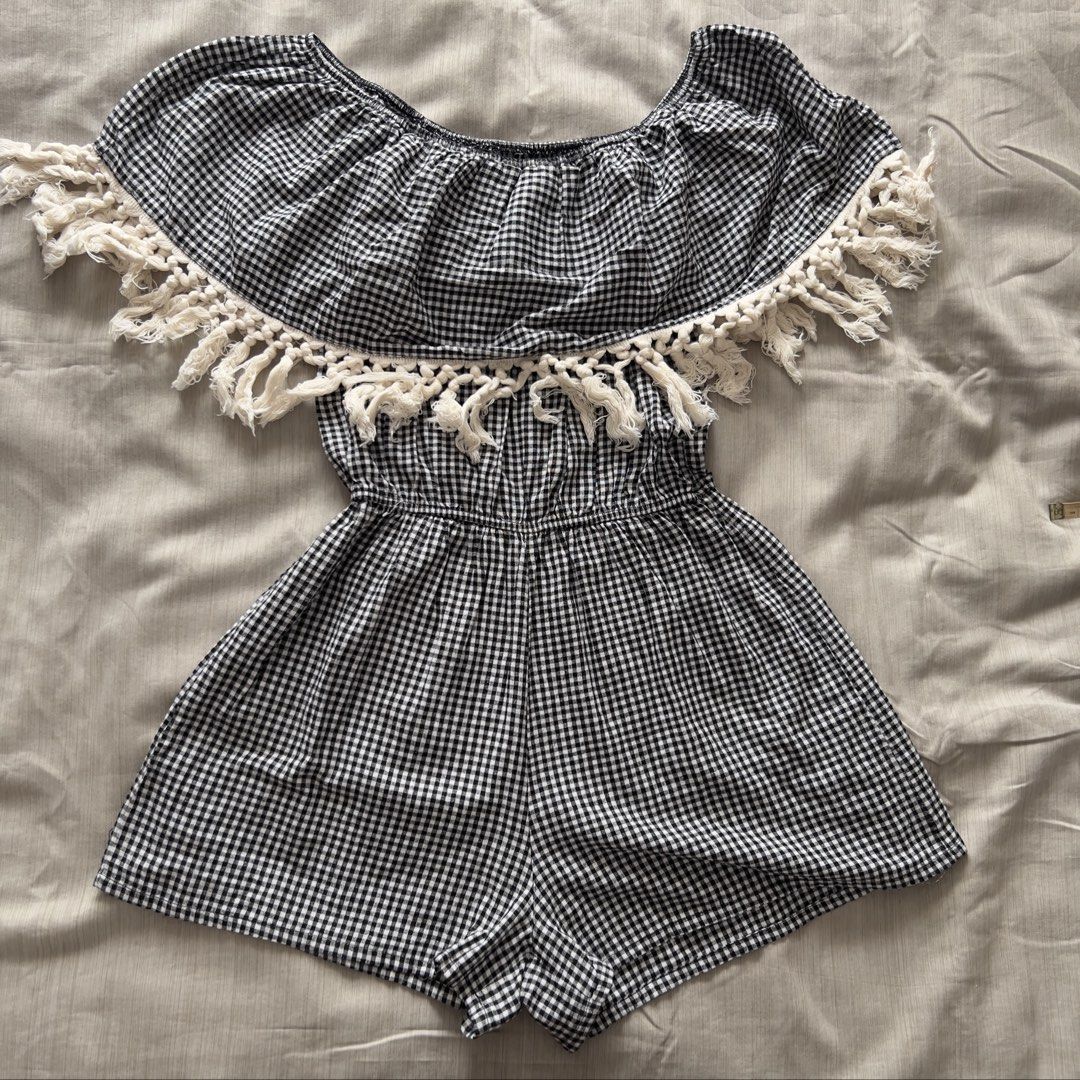 Black White Gingham Off Shoulder Tassel Romper (Category: Rompers) located in Pasig City. Submitted by jenscloset86 (Listing ID 1470002971, Image 1). Description: Size: Free Size • No damage, no flaws Measurement : Waist: 11” - 17” when stretched Length: 24”.