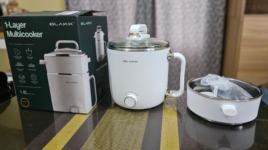 Blakk 1-Layer Multicooker 1.8L White (Category: Cookers) located in Mandaluyong City. Submitted by filmstrips (Listing ID 1469965249, Image 1). Description: - Brand: Blakk 1-layer multicooker - Capacity: 1.8L, ideal for solo living or small meals - Pot: Durable stainless steel inner pot with a clear glass - Inclusions: Steamer tray and egg holder attachment - Original box included.