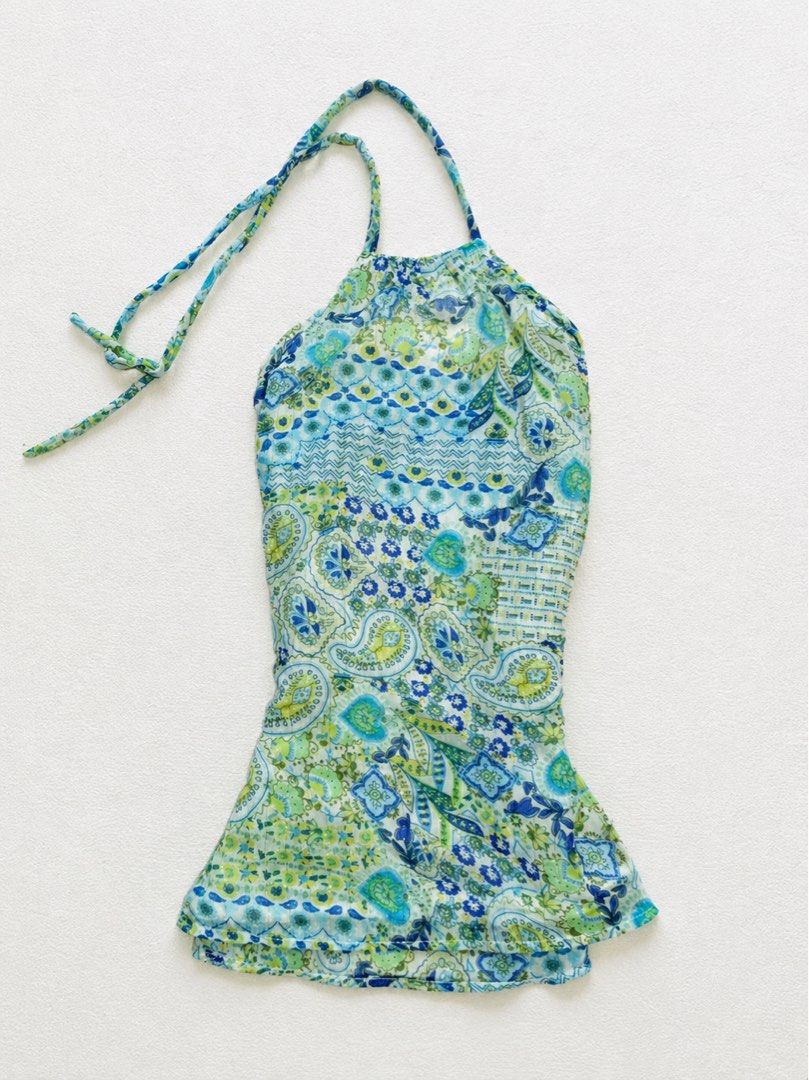 Blue and Green Paisley Halter Top (Category: Sleeveless) located in Sarangani. Submitted by solune_clo (Listing ID 1470080714, Image 1). Description: - Vibrant blue and green paisley and floral print - Adjustable halter neck ties for a custom fit - Lightweight fabric with a flattering flared hem - Perfect for beach trips, vacations, and hot weather.
