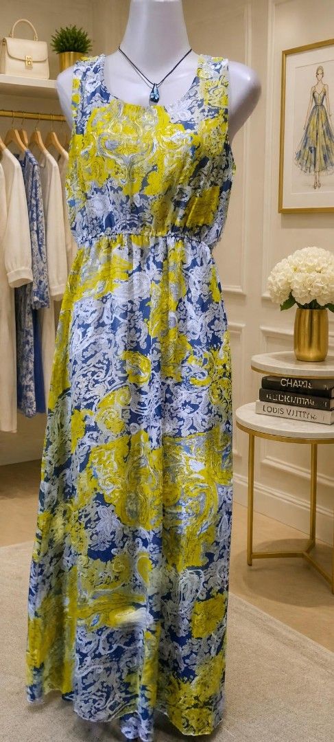 Blue and yellow patterned sleeveless maxi dress (Category: Dresses) located in Manila. Submitted by gracjam_27 (Listing ID 1470032666, Image 1). Description: - Vibrant blue, yellow, and white pattern - Sleeveless design with a comfortable round neckline - Elastic waist for a flattering, gathered flowy skirt - Lightweight floor-length fabric - Ideal for warm weather, brunches, and summer events - Easy slip-on style.
