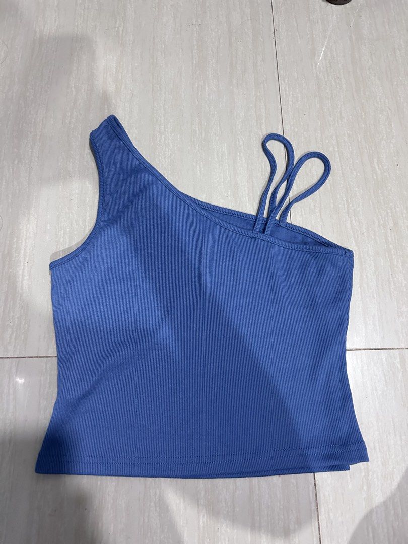 Blue Asymmetric Ribbed Tank Top with Multi Straps (Category: Sleeveless) located in Manila. Submitted by lovely.453 (Listing ID 1470049021, Image 1). Description: - Color: Bright blue size medium to large - Material: Stretchy, lightweight cotton-blend - Design: Ribbed texture with trendy asymmetrical neckline and double thin straps on one side - Fit: Fitted, great for warm weather - Styling: Pairs effortlessly with high-waisted jeans or shorts - 